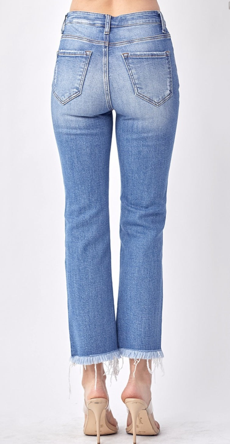 Risen mid rise raw hem jeans