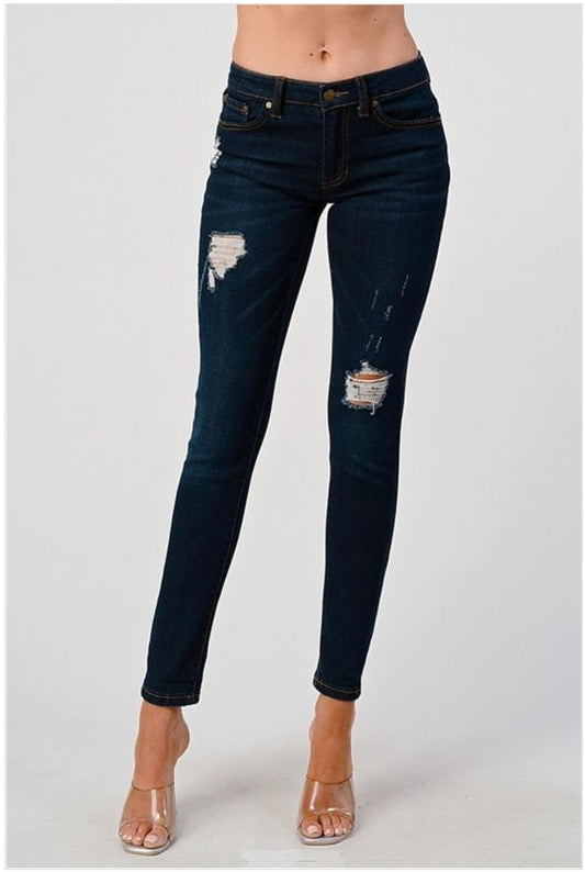 Mid rise distressed skinny jean